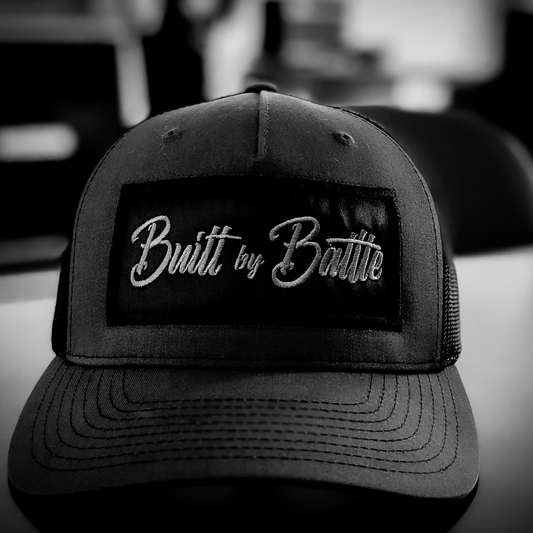 Built By Battle hat on office desk